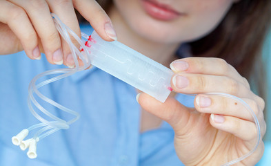 Poster - Girl holding polymers Bio-MEMS biomedical microelectromechanical systems / LOC lab-on-a-chip device (concept design)