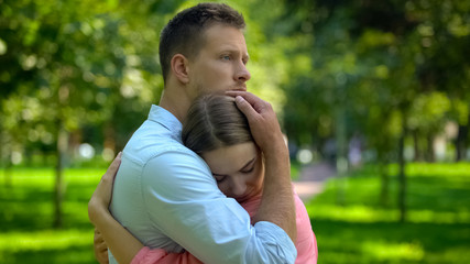 Wall Mural - Loving boyfriend hugging girlfriend, tender relations, couple closeness, support