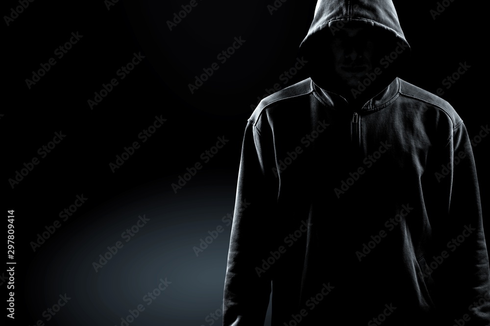 Thief in black clothes on grey background - obrazy, fototapety, plakaty 