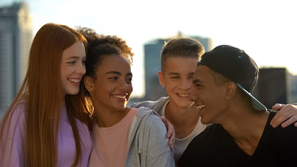 Joyful multi-racial group of young people enjoying friendship unity, having fun