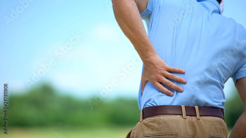 Fotomural Sportsman suffering terrible lower back pain, inflammation result, trauma