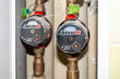 © MariiaDemchenko - Sealed hot and cold water meters placed in a recess in the bathroom wall on the pipes. On the hot water meter, the value is zero, because the hot water is turned off