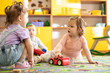 © Oksana Kuzmina - Nursery babies girls and boy playing together in a play room