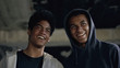 © motortion - Two afro-american friends in hoodie laughing together, black teenage buddies