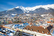 Innsbruck in winter, Austria. Beautiful aerial panoramic view, mountains covered with snow in the background. 