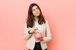 © Asier - Young caucasian woman holding a piggy bank