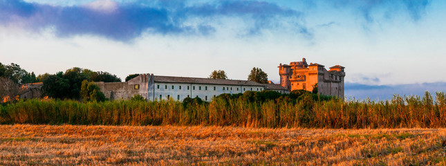 Canvas Print - Medieval castles of Italy - Castello di Santa Severa on the beach over sunrise.