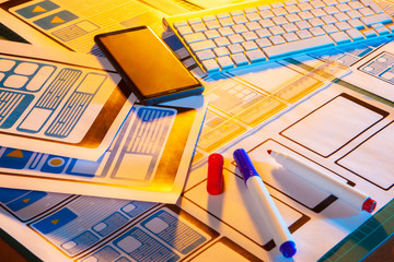 Wall Mural - layout interface app on the desktop. smartphone designer. application architecture. markers on the d
