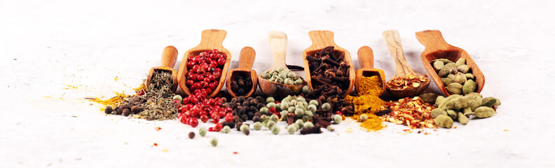 Spices with pepper on table. Food and cuisine ingredients for cooking on rustic background