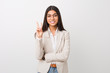 © Asier - Young business arab woman isolated against a white background showing number two with fingers.