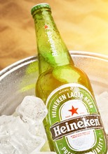 Bottles Of Cold And Fresh Beer With Ice Isolated On White