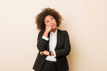 Young business african american woman who feels sad and pensive, looking at copy space.