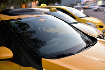 taxi service on city street in dusk