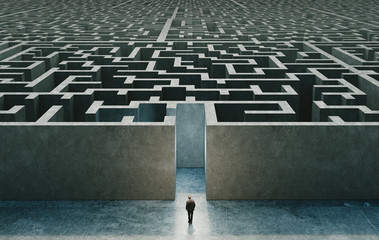 Businessman standing in front of the entrance to the maze. 3d rendering