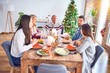 © Krakenimages.com - Beautiful family meeting smiling happy and confident. Eating roasted turkey celebrating Christmas at home