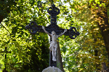 Cross and tombstone on an old cemetery.  