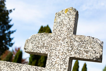 Old Terrazzo Tombstone At A Christian Cemetery. Gravestone With A Partly Damaged Cross. All Saints Day.