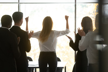 Wall Mural - motivated female leader get team applause celebrate success victory