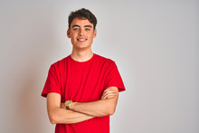 Teenager Boy Wearing Red T-shirt Over White Isolated Background Happy Face Smiling With Crossed Arms Looking At The Camera. Positive Person.