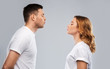 © Syda Productions - love, valentines day and relationships concept - portrait of happy couple in white t-shirts ready for kiss over grey background