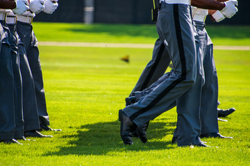 Sticker - Lower body view of the gray uniform pants of Army cadets as they march