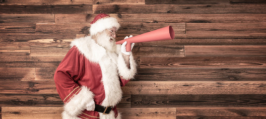 Wall Mural -  Santa Claus screaming by megaphone.