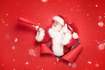 Wall Mural - Santa Claus with red megaphone.