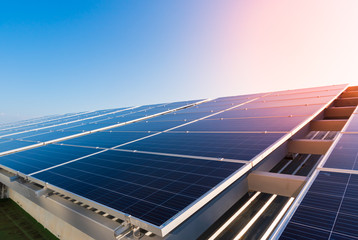 solar panels and blue sky background.solar cells farm on the roof.photovoltaic modules for renewable