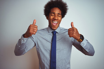 Sticker - American business man with afro hair wearing shirt and tie over isolated white background excited for success with arms raised and eyes closed celebrating victory smiling. Winner concept.