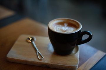 Wall Mural - cup of coffee latte art in cafe