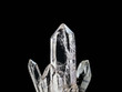 Macro photography of natural minerals from geological collection - clear quartz stone (rhinestone) on isolated black background. Zen meditation or relaxation concept.