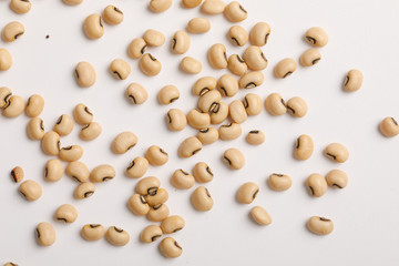 Wall Mural - Black eyed beans on white background 