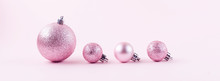 Pink Christmas Balls On Pink Paper Background