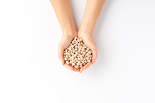 Overhead Shot Of Woman’s Hands Holding Chickpeas Beans Isolated On White Background