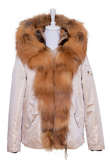 Wall Mural - Fur clothes isolated. A stylish and luxurious bright female winter jacket with fur hood and large collar on mannequin isolated on a white background. Winter fashion.