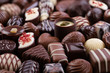 chocolate candy with various fillings, sweet food background.
