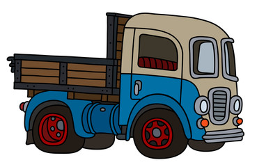 Canvas Print - The vectorized hand drawing of a funny old blue and cream lorry truck