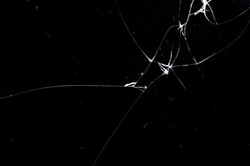 Wall Mural - cracked glass isolated on a black background.