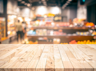 Wall Mural - Wood texture table top (counter bar) with blur grocery,market store background