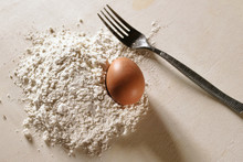 Egg, Flour And Fork To Prepare Fresh Pasta