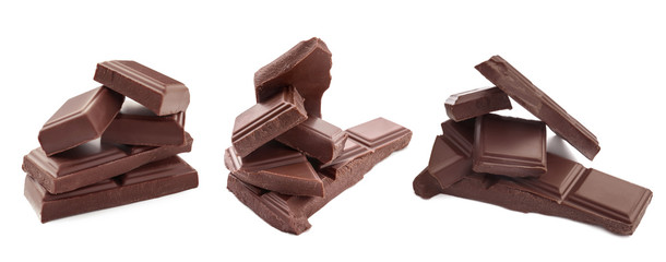 Wall Mural - Delicious chocolate pieces on white background
