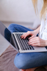 Wall Mural - closeup woman hands typing on laptop keyboard.