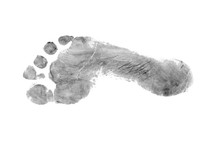 The Imprint Of A Man's Bare Foot On A White Background.