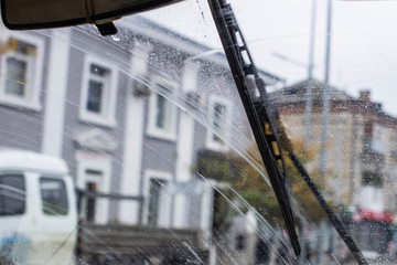 Wall Mural - Windshield wipers from inside of car, season rain.