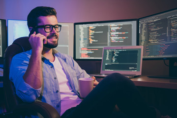 portrait of his he nice attractive cheerful cheery brunet guy geek talking on phone remote support e
