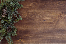 New Year's Background. Spruce Branches On A Wooden Table. Ornaments For The New Year Tree. Christmas Concept.