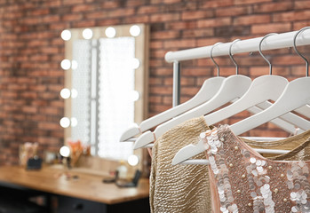 Canvas Print - Hangers with stylish clothes on rack in makeup room