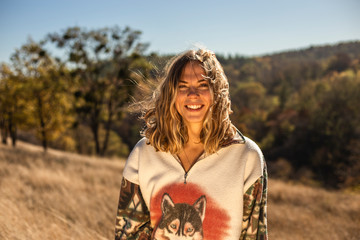 Wall Mural - Kanev.Ukraine 18-10-2019 : Cheerful beautiful woman with happy smile standing outdoors after a great healthy hike