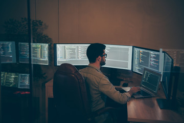 Photo of it-specialist working on global project using laptop testing alpha version of newly developed software checking bug existence debugging script code
