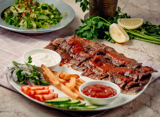 Poster - iskender kebab with french fries and vegetables